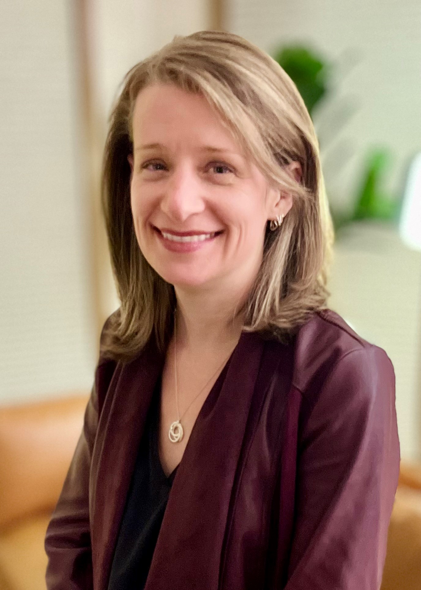 Smiling woman with shoulder-length hair